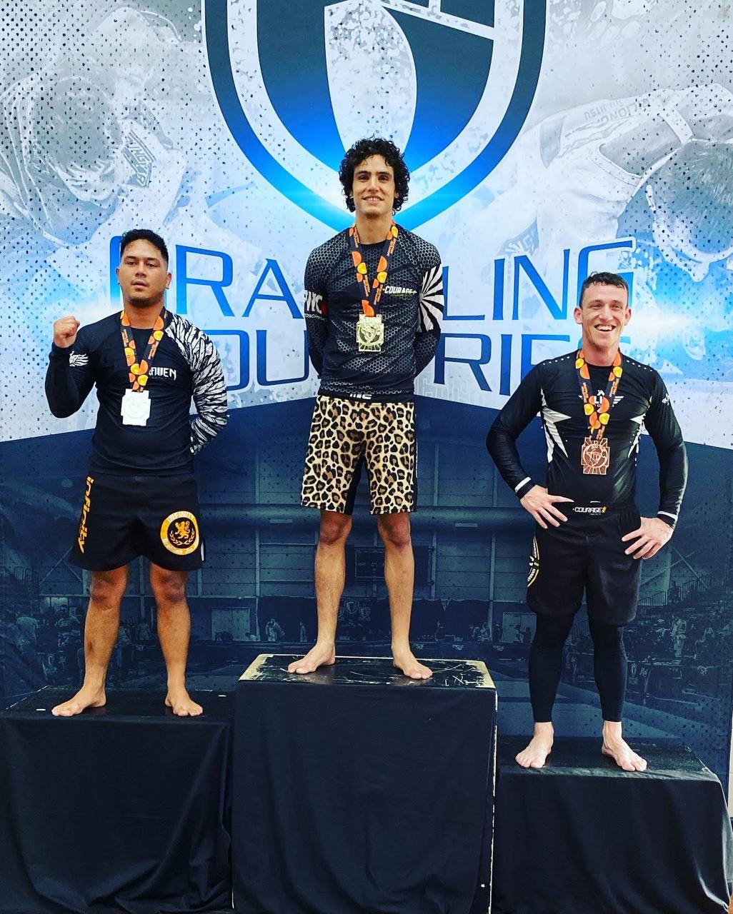 Joseph on podium with gold medal