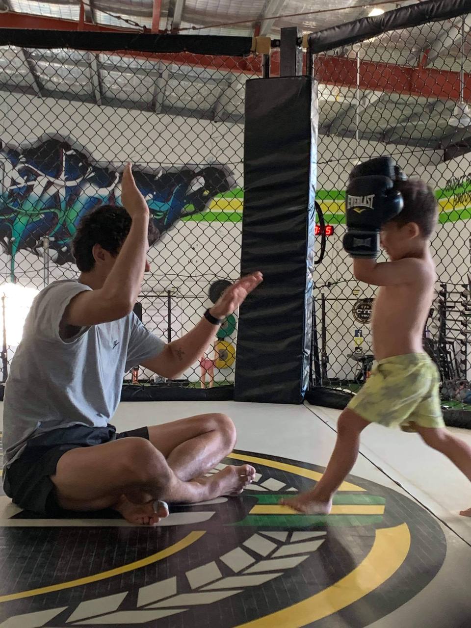 Joseph coaching a young student at Soul Lab Gym