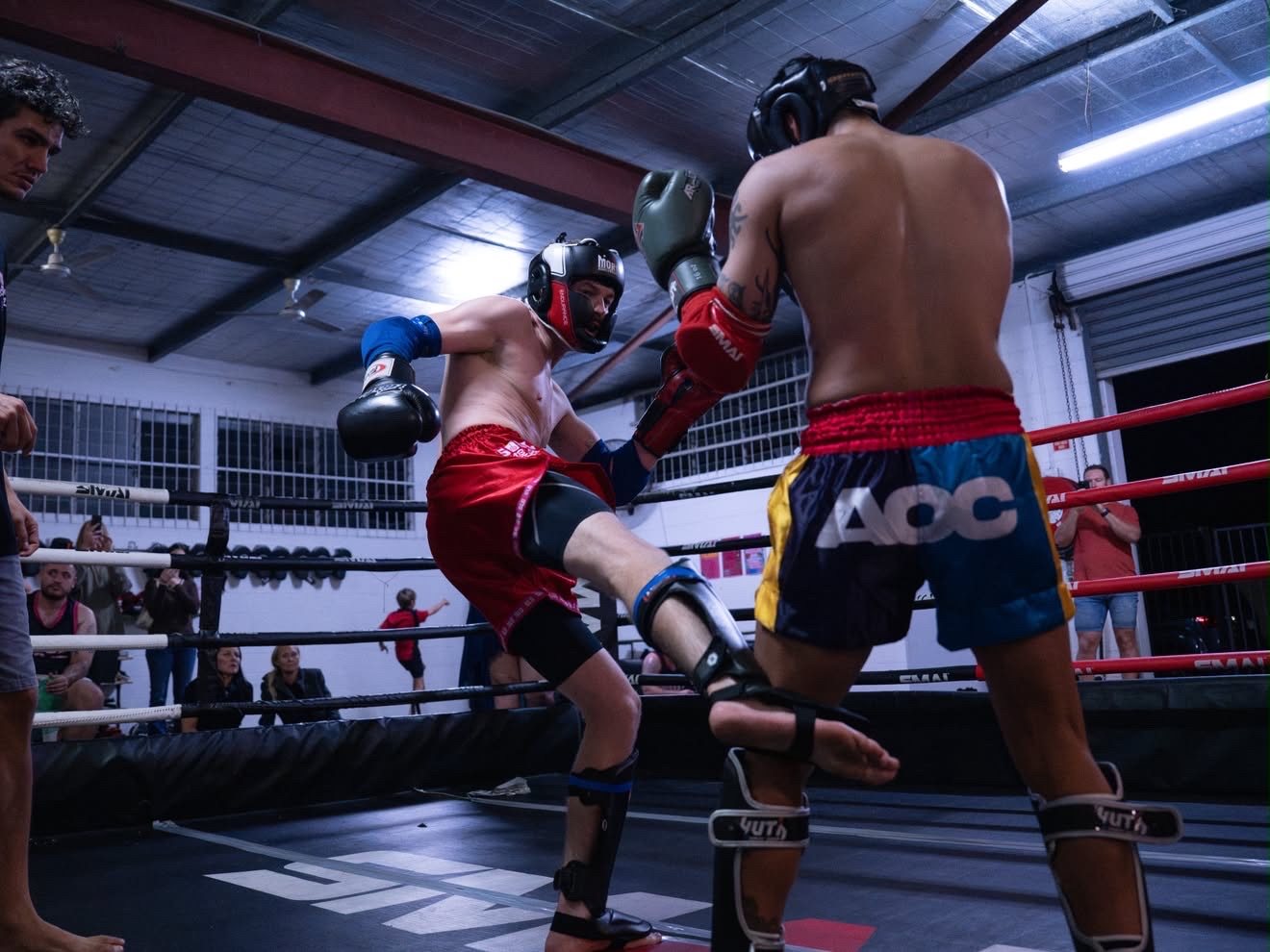 Fighter throwing a teep in headgear at Battle at the Lab 4