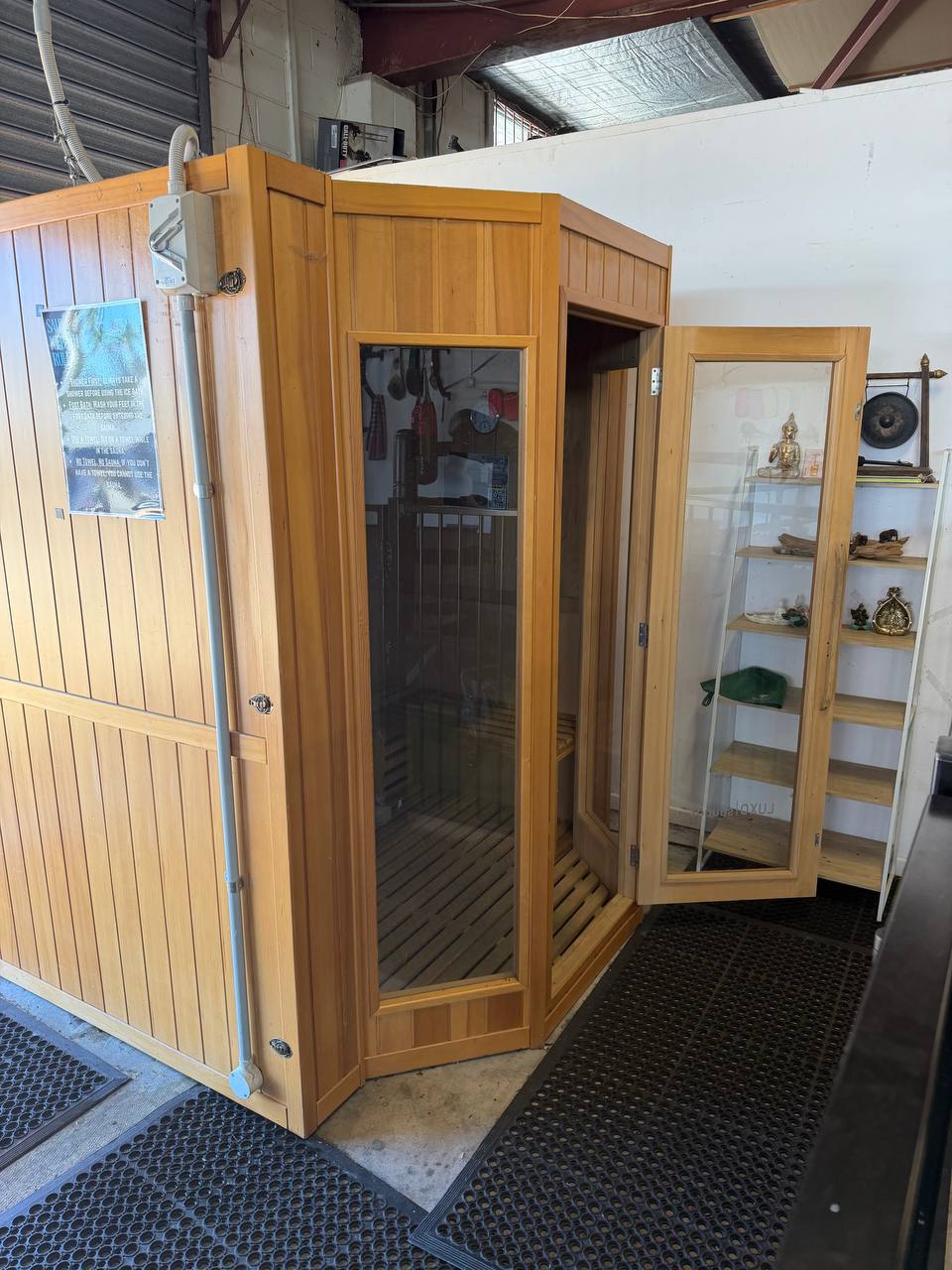 Interior of the sauna showing traditional volcanic rocks