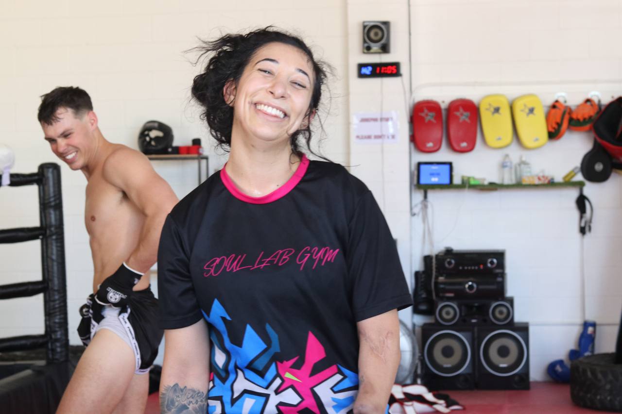 Woman in Soul Lab shirt
